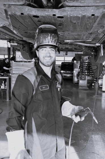 Mechanic standing welding